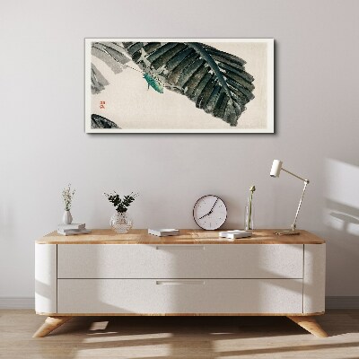 Vászonkép Egy karcsú rovar a leveleken