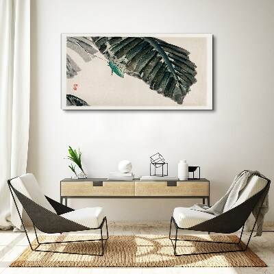 Vászonkép Egy karcsú rovar a leveleken