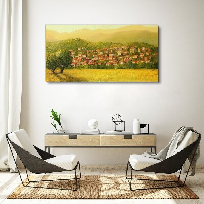 Vászonkép Napfényes falu a dombok között