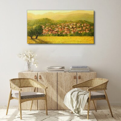 Vászonkép Napfényes falu a dombok között