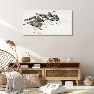 Vászonkép Egy nyáj madár fehér háttér előtt