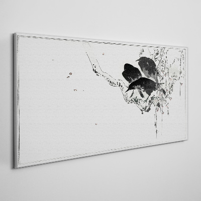Vászonkép Fekete madarak egy ágon
