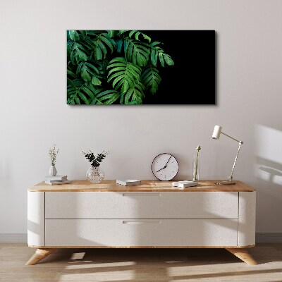 Vászonkép Zöld levelek fekete alapon