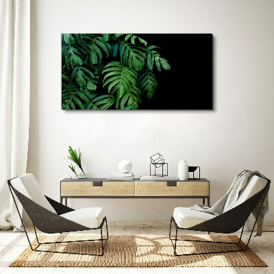 Vászonkép Zöld levelek fekete alapon