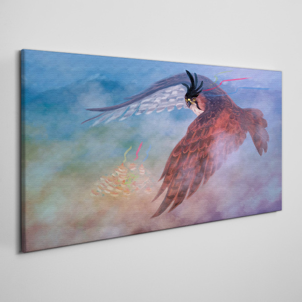 Vászonkép Egy ragadozó madár repülése a felhőkben