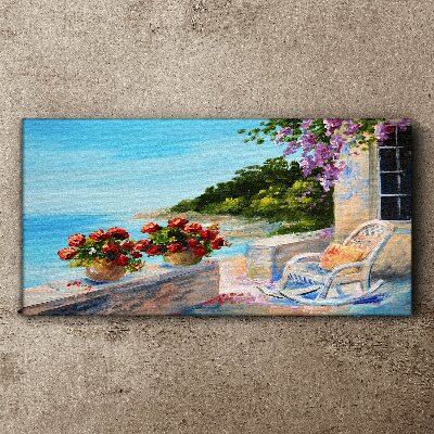 Vászonkép Virágok és a tenger egy napos tájon