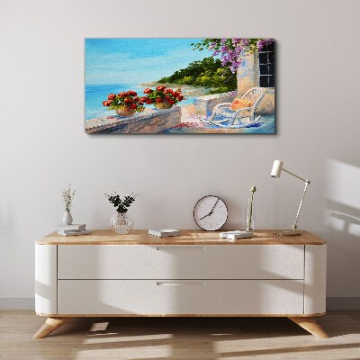 Vászonkép Virágok és a tenger egy napos tájon