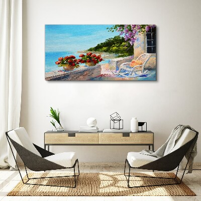 Vászonkép Virágok és a tenger egy napos tájon