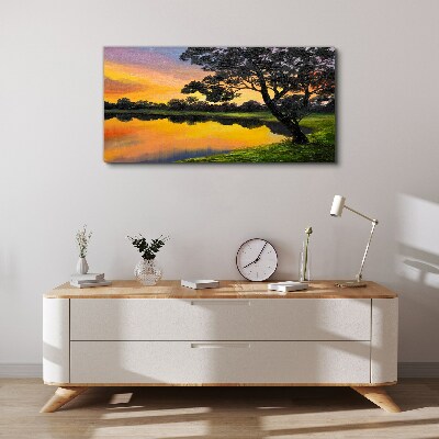 Vászonkép Naplemente a tó felett