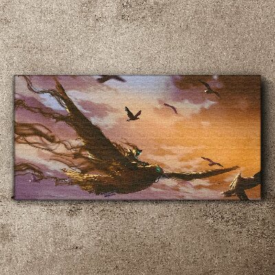 Vászonkép Madarak repülése a lenyugvó napon