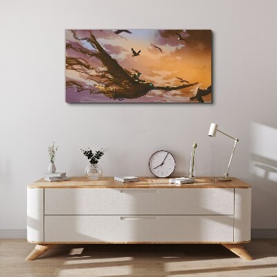 Vászonkép Madarak repülése a lenyugvó napon
