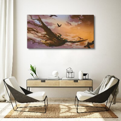 Vászonkép Madarak repülése a lenyugvó napon