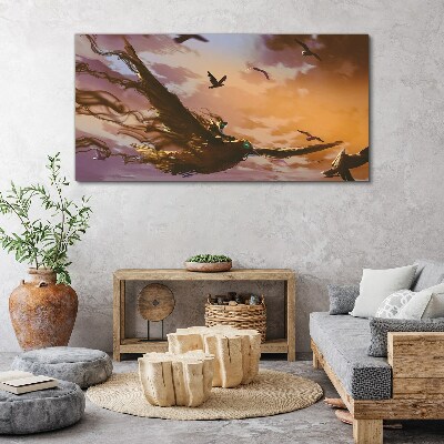 Vászonkép Madarak repülése a lenyugvó napon