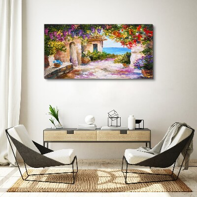 Vászonkép Egy tengerparti falu virágsikátora