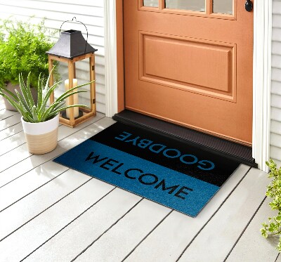 Szőnyegek a bejárati ajtó előtt Üdvözöljük búcsú